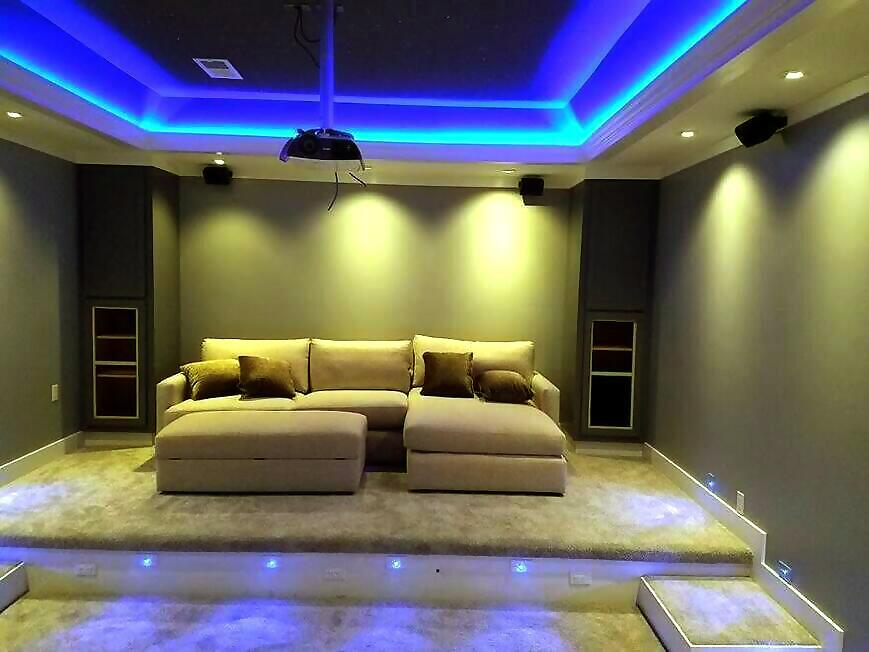 Home theater with professional recessed lighting and LED ambient strips